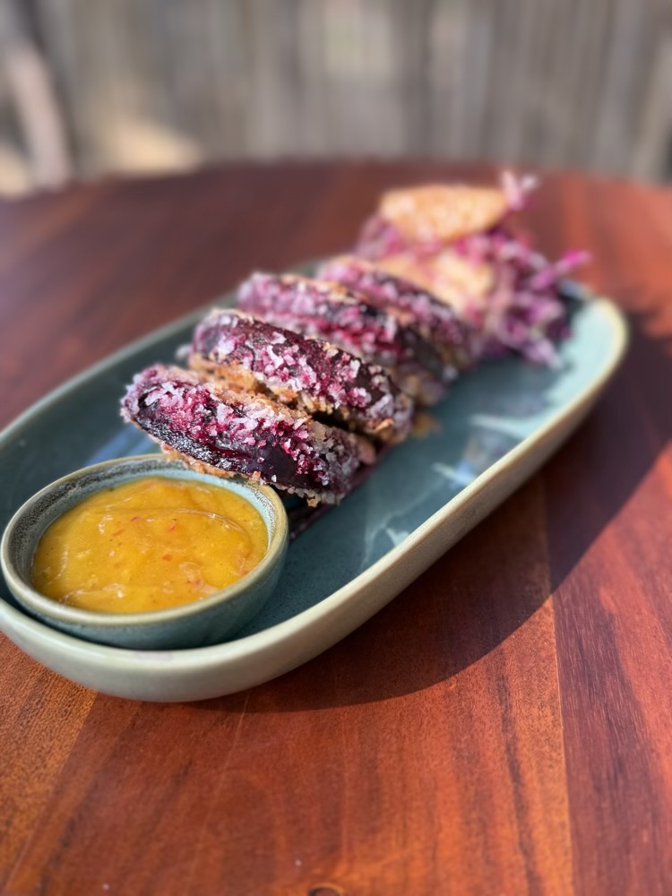 Beetroot and coconut slices & red cabbage slaw with orange mango vinaigrette at Roots & Bloom Café in Palolem
